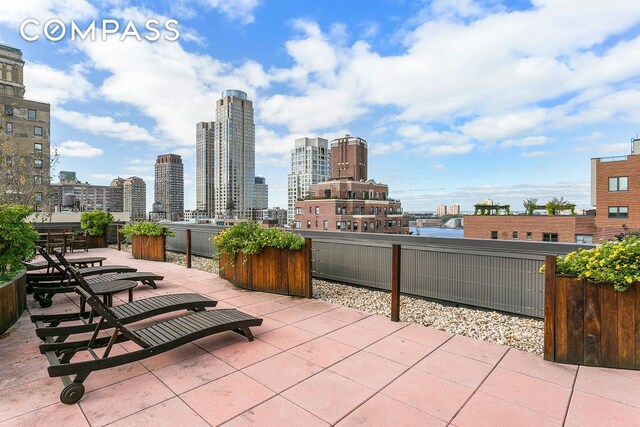 view of patio with a city view