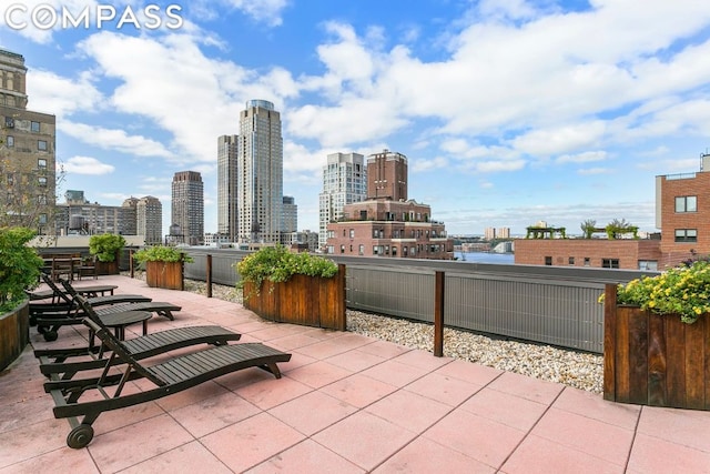 view of patio / terrace featuring a city view