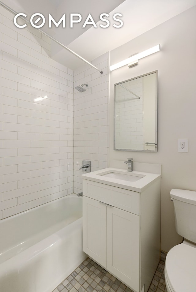 full bathroom with toilet, vanity, and shower / bathing tub combination