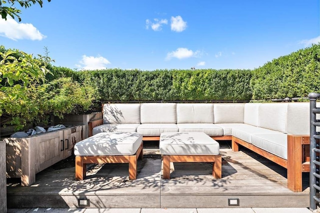 wooden deck featuring an outdoor living space