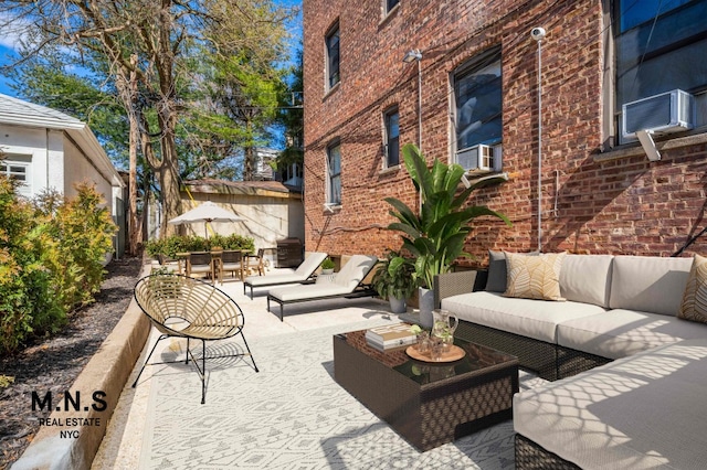 view of patio / terrace with an outdoor living space and cooling unit