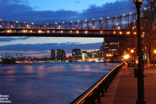 water view featuring a notable bridge and nearby urban area