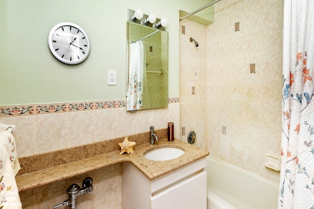 bathroom with shower / tub combo and vanity
