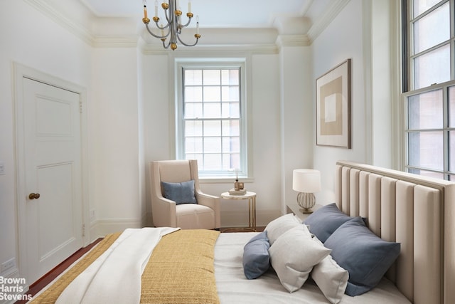 bedroom featuring a notable chandelier, radiator heating unit, ornamental molding, and hardwood / wood-style floors