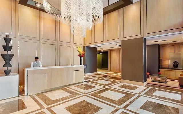 reception area featuring an inviting chandelier