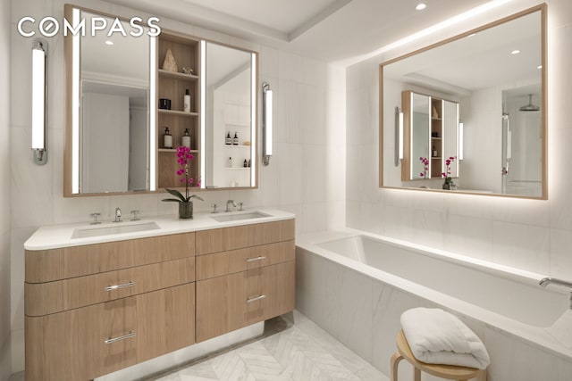 bathroom featuring a bath, double vanity, tile walls, and a sink