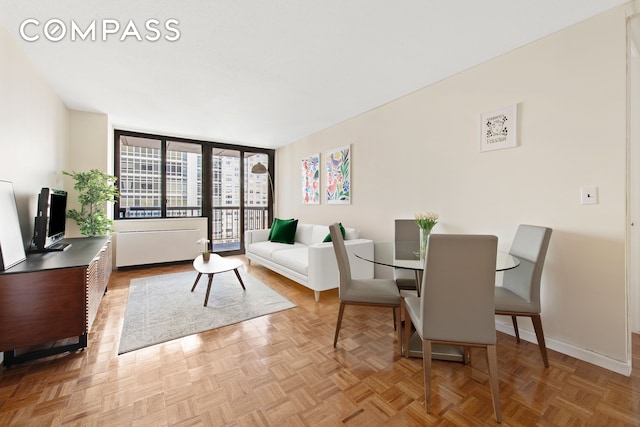 dining space featuring baseboards