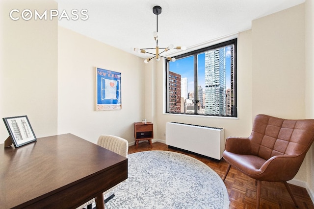 office space featuring radiator heating unit, an inviting chandelier, and parquet floors