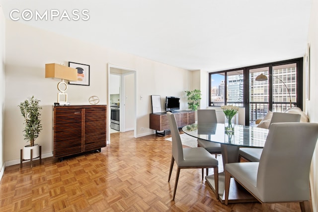 dining space featuring baseboards