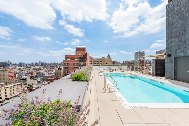 view of swimming pool with a patio area