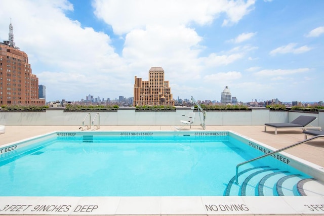 view of swimming pool featuring a water view