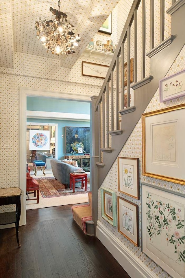 45 E 9th St Unit 45, New York City, NY 10003 - staircase with hardwood / wood-style floors, wallpapered walls, and a chandelier