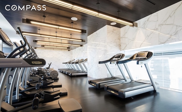 workout area with stone wall