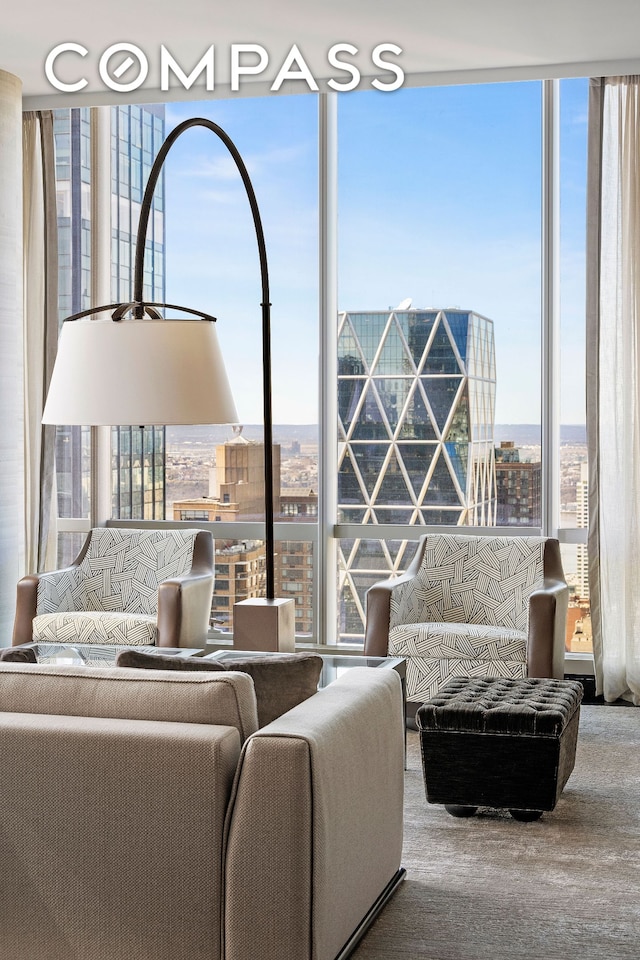 living room featuring a city view and floor to ceiling windows