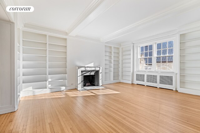 bedroom with beamed ceiling and hardwood / wood-style floors