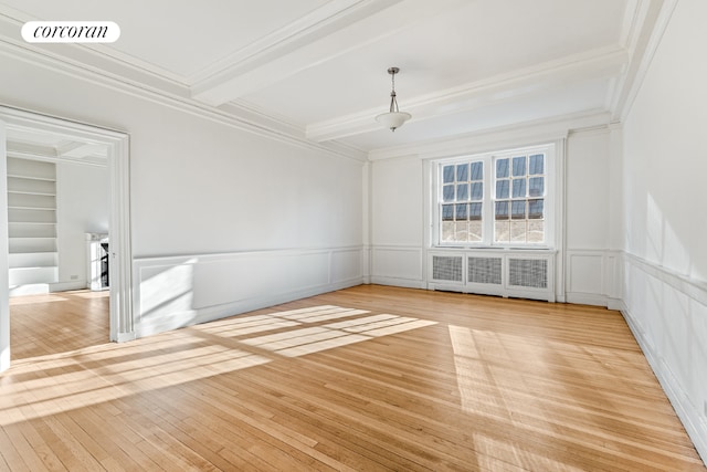 empty room featuring light hardwood / wood-style floors, basketball court, radiator, crown molding, and beamed ceiling