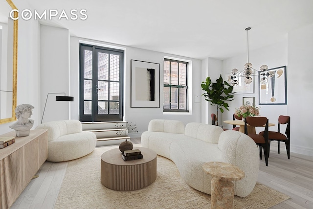 100 Barclay St Unit 11C, New York City, NY 10007 - living room with light wood-style floors and a chandelier