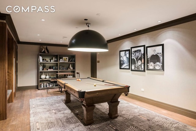 game room with crown molding, billiards, and light wood-type flooring