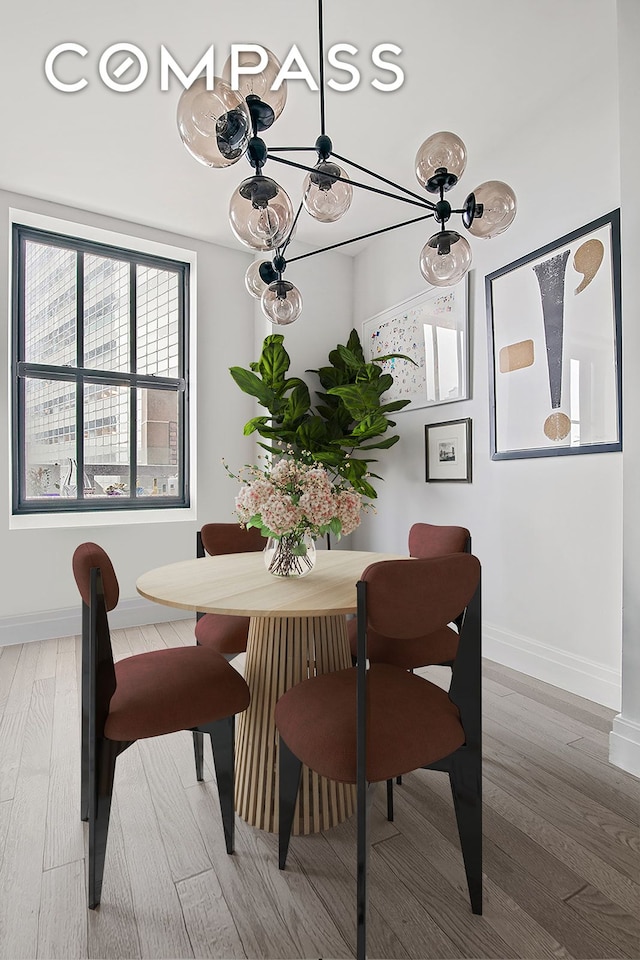 100 Barclay St Unit 11C, New York City, NY 10007 - dining space with a chandelier and wood finished floors