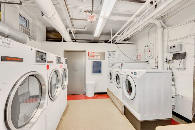 9707 4th Ave Unit 3R, New York City, NY 11220 - communal laundry room with washer and clothes dryer and light flooring