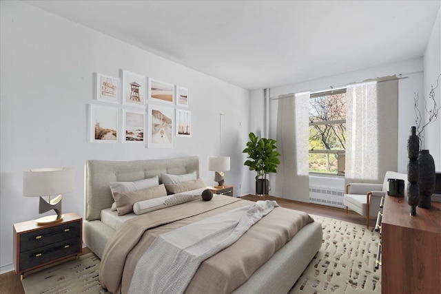 501 W 123rd St Unit 3A, New York City, NY 10027 - bedroom with radiator heating unit and light wood-style flooring