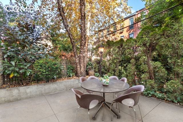 view of patio featuring outdoor dining area