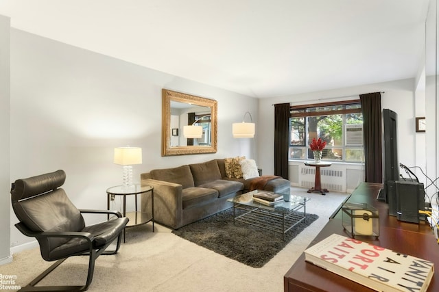 carpeted living room featuring radiator heating unit