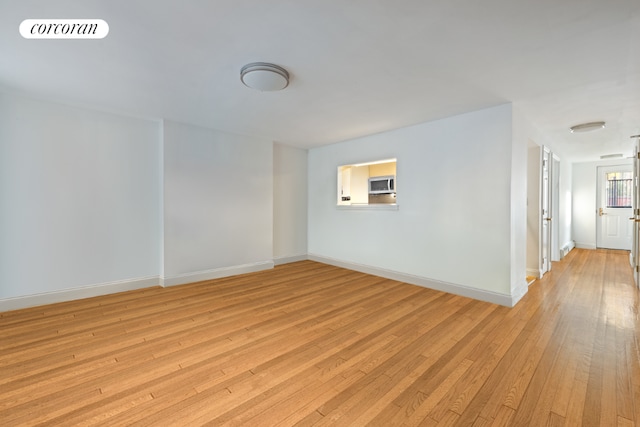 unfurnished room featuring light hardwood / wood-style floors