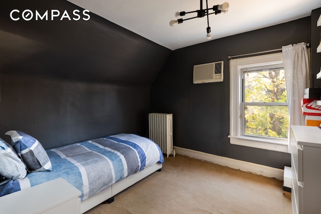 bedroom with carpet floors, radiator, an AC wall unit, vaulted ceiling, and baseboards