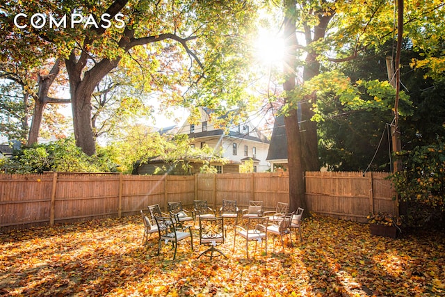 view of yard with an outdoor fire pit and a fenced backyard