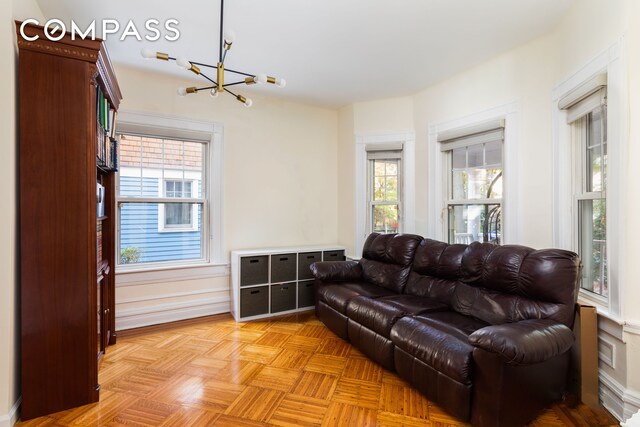 living area featuring an inviting chandelier