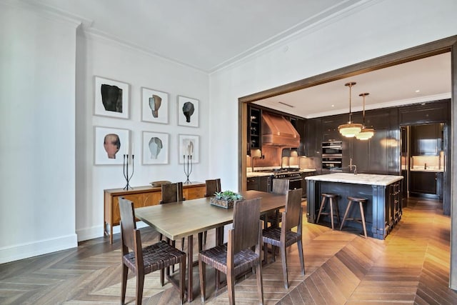 dining space featuring parquet flooring and ornamental molding