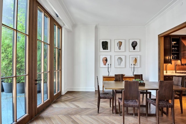 dining room featuring parquet floors and ornamental molding