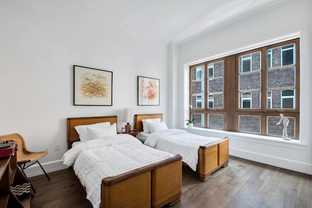 bedroom featuring crown molding and hardwood / wood-style flooring