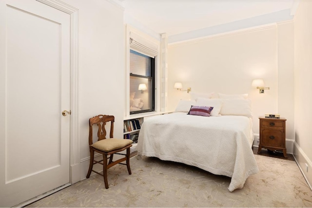 bedroom with light colored carpet and crown molding