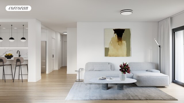 living area featuring light wood-style flooring and visible vents