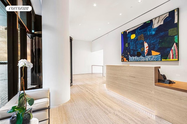 living room featuring hardwood / wood-style flooring and wooden walls