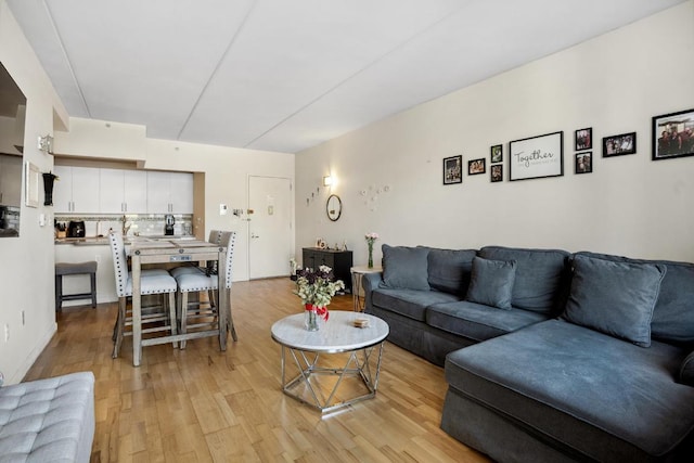 living room with light hardwood / wood-style flooring