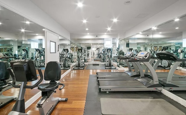 exercise room featuring recessed lighting and wood finished floors