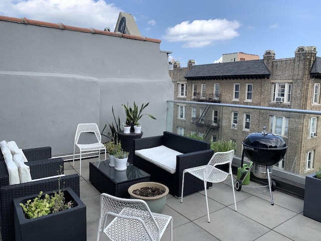 exterior space with grilling area and outdoor lounge area