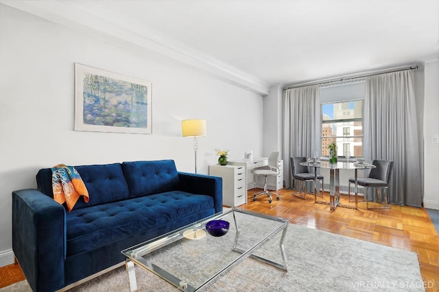 living room featuring crown molding and parquet floors