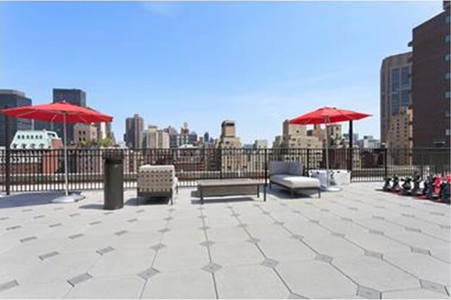 220 Madison Ave Unit 15N, New York City, NY 10016 - view of patio / terrace with an outdoor living space with a fire pit and a view of city