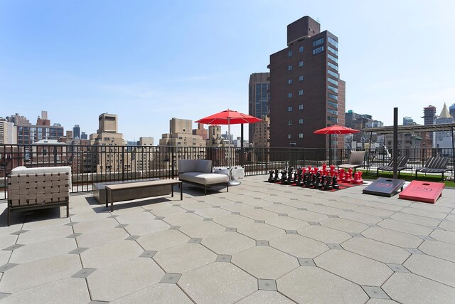 220 Madison Ave Unit 15N, New York City, NY 10016 - view of patio / terrace with an outdoor living space with a fire pit and a view of city
