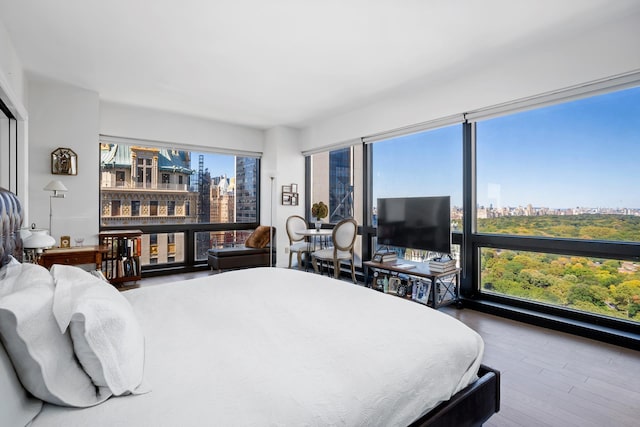 721 5th Ave Unit 33G, New York City, NY 10022 - bedroom featuring wood finished floors