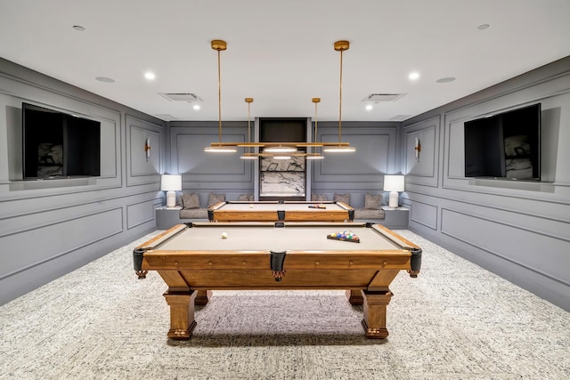 recreation room featuring a decorative wall, recessed lighting, carpet flooring, and visible vents