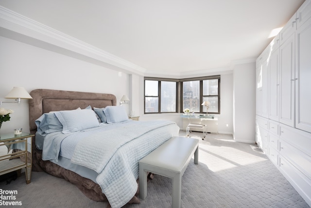 bedroom featuring light carpet and ornamental molding