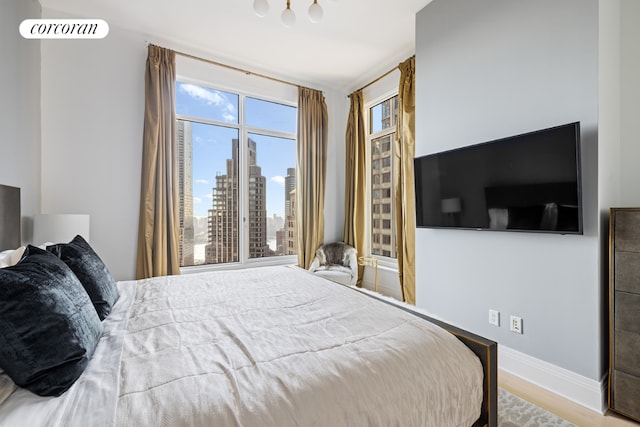 bedroom with light hardwood / wood-style flooring