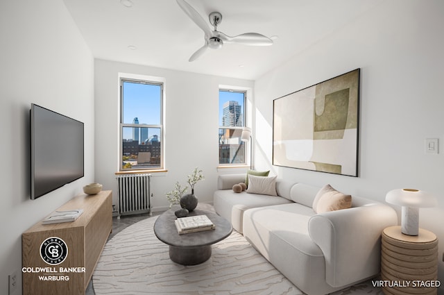 living room featuring ceiling fan and radiator