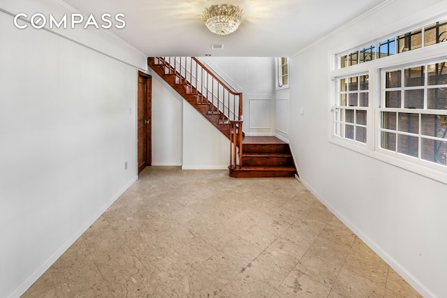60 82nd St, New York City, NY 11209 - stairway with crown molding and a chandelier