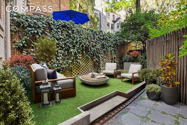 view of patio featuring fence